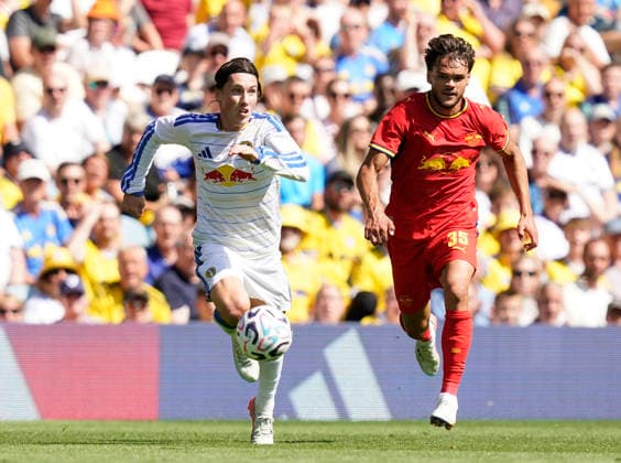 Leeds, England, 8th August 2026. Harry Wilson of Leeds United (L) is challenged by Max Finkgräfe of RB Leipzig during the Leeds United vs RB Leipzig Pre Season Friendly match at Elland Road, Leeds. Picture credit should read: Andrew Yates Sportimage EDITORIAL USE ONLY. No use with unauthorised audio, video, data, fixture lists, club league logos or live services. Online in-match use limited to 120 images, no video emulation. No use in betting, games or single club league player publications. SPI_005_AY_LEEDS_LEIPZIG SPI-4898-0005