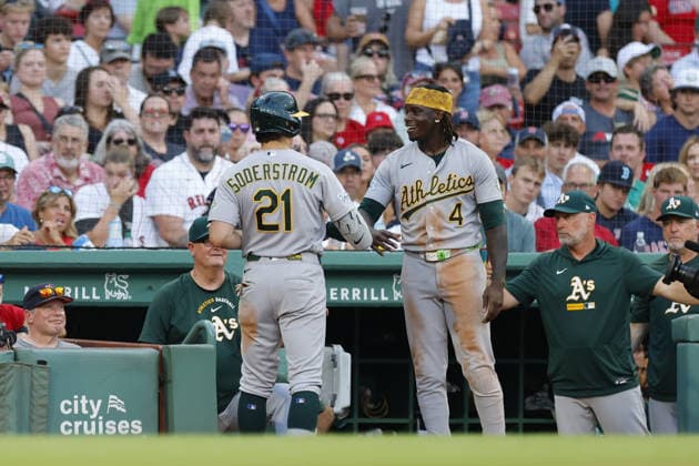 Athletics Tyler Soderstrom, left, is greeted by Athletics Lawrence Butler, right, after Soderstrom hit solo home run during the seventh inning against the Boston Red Sox at Fenway Park in Boston, Massachusetts on Saturday, August 8, 2026.  BOP20260808 CJxGUNTHER