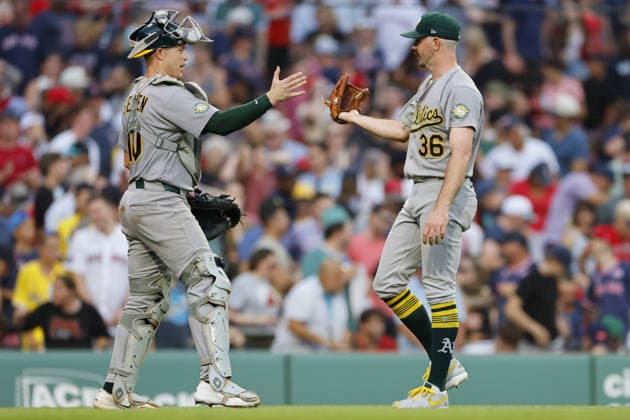 Athletics pitcher Hogan Harris, right, is greeted by Athletics catcher Brian Serven, left, after the Athletics defeated the Boston Red Sox at Fenway Park in Boston, Massachusetts on Saturday, August 8, 2026.  BOP2026080823 CJxGUNTHER
