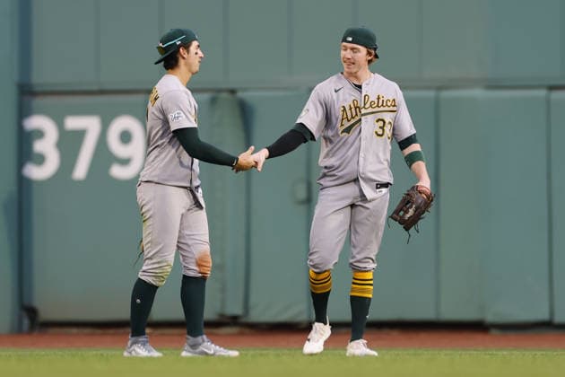 Athletics center fielder Henry Bolte, right, is congratulated by Athletics left fielder Tyler Soderstrom, left, after Bolte made the final put out of the game against the Boston Red Sox at Fenway Park in Boston, Massachusetts on Saturday, August 8, 2026.  BOP2026080824 CJxGUNTHER