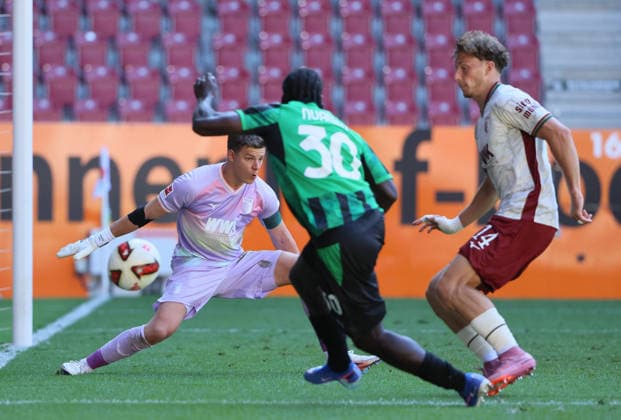 (260809) -- AUGSBURG, Aug. 9, 2026 -- Finn Dahmen (L), goalkeeper of FC Augsburg, defends during the friendly football match between FC Augsburg and Sassuolo in Augsburg, Germany, Aug. 8, 2026. (Photo by Xinhua) (SP)GERMANY-AUGSBURG-FOOTBALL-FRIENDLY MATCH-AUGSBURG VS SASSUOLO PhilippexRuiz 