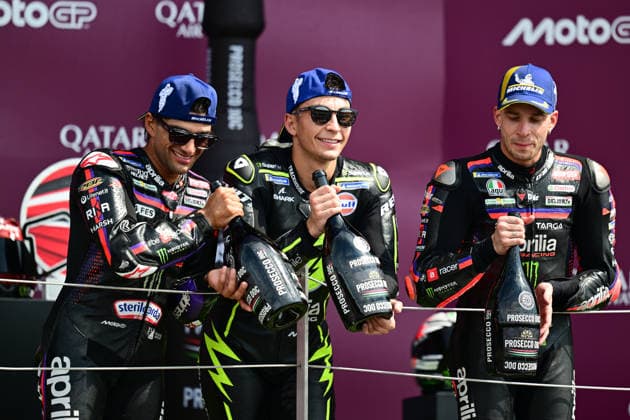 motor racing, Motorsport Moto GP Qatar Airways Grand Prix of Great Britain Monster Energy Yamaha MotoGP rider Jorge Martin (89) , Superfile Trackhouse MotoGP Team rider Raul Fernandez (25) and Aprilia Racing rider Marco Bezzecchi (72) on the podium holding bottles of Prosecco during the Moto GP Qatar Airways Grand Prix of Great Britain at Silverstone, Towcester, UK on 9 August 2026. Towcester Silverstone Northamptonshire UK Editorial use only , Copyright: xDennisxGoodwinx PSI-24671-0038