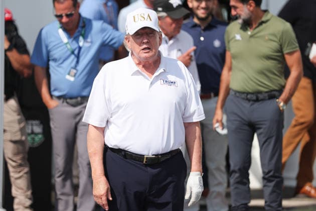 BEDMINSTER, NJ - AUGUST 09: President Donald Trump walks out of the clubhouse at Bedminster before the forth round of LIV Golf New York on August 9, 2026 at Trump National Golf Club in Bedminster, New Jersey. (Photo by Andrew Mordzynski Icon Sportswire) GOLF: AUG 09 LIV Golf New York EDITORIAL USE ONLY Icon2608098162828