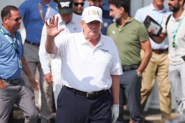 BEDMINSTER, NJ - AUGUST 09: President Donald Trump walks out of the clubhouse at Bedminster before the forth round of LIV Golf New York on August 9, 2026 at Trump National Golf Club in Bedminster, New Jersey. (Photo by Andrew Mordzynski Icon Sportswire) GOLF: AUG 09 LIV Golf New York EDITORIAL USE ONLY Icon2608098162833
