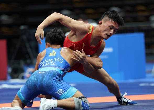 (260809) -- XI AN, Aug. 9, 2026 -- Munkh-erdene Batkhuyag (front) of Mongolia and Bai Jiliang of China compete during the men s freestyle 57kg final at 2026 China-Central Asia Elite Wrestling Tournament in Xi an, northwest China s Shaanxi Province, Aug. 9, 2026. ) (SP)CHINA-XI AN-WRESTLING-2026 CHINA-CENTRAL ASIA ELITE WRESTLING TOURNAMENT (CN) LixYibo 