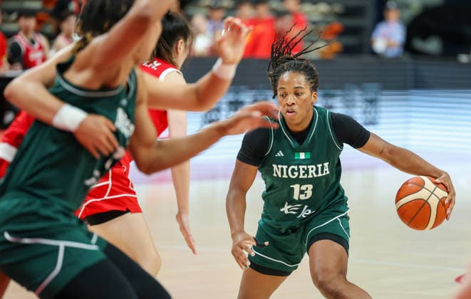 (260809) -- HAIKOU, Aug. 9, 2026 -- Gabrielle White (R) of Nigeria competes during a friendly basketball match between China and Nigeria in Haikou, south China s Hainan Province, Aug. 9, 2026. ) (SP)CHINA-HAIKOU-BASKETBALL-FRIENDLY-CHINA VS NIGERIA (CN) YangxGuanyu 
