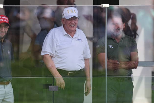 BEDMINSTER, NJ - AUGUST 09: President Donald Trump smiles at golfers at his golf course at Bedminster during the forth round of LIV Golf New York on August 9, 2026 at Trump National Golf Club in Bedminster, New Jersey. (Photo by Andrew Mordzynski Icon Sportswire) GOLF: AUG 09 LIV Golf New York EDITORIAL USE ONLY Icon2608098173335