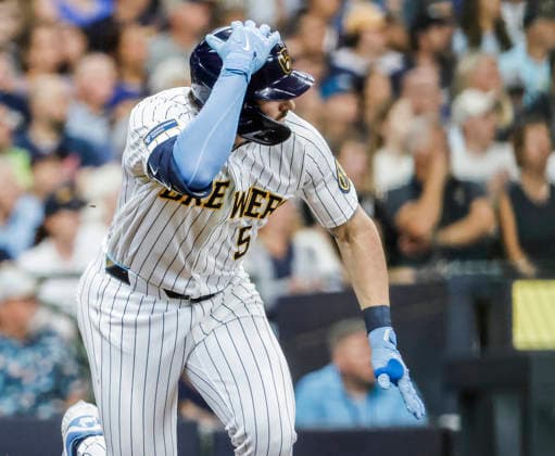 Milwaukee Brewers center fielder Garrett Mitchell holds onto his helmet after hitting a single in the sixth inning of the MLB, Baseball Herren, USA game between the Minnesota Twins and the Milwaukee Brewers at American Family Field in Milwaukee, Wisconsin on Sunday, August 9, 2026.  MIL20260809824 TANNENxMAURY
