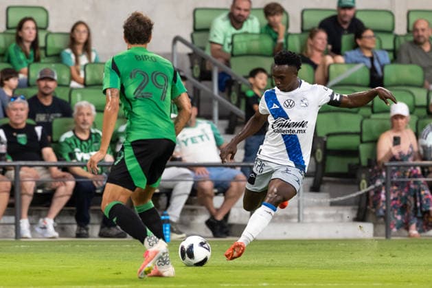 AUSTIN, TX - AUGUST 09: Midfielder Kevin Velasco 26 of Club Puebla readies to cross the ball as defender Guilherme Biro 29 of the Austin FC readies to defend during the Leagues Cup match between Austin FC and Club Puebla on August 9, 2026, at Q2 Stadium in Austin, TX. (Photo by David Buono Icon Sportswire) SOCCER: AUG 09 Leagues Cup Austin vs Puebla EDITORIAL USE ONLY Icon260809008