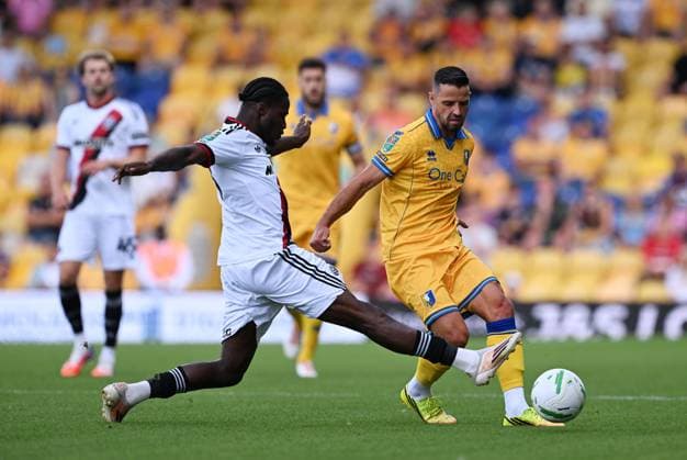 Femi Seriki of Sheffield United and Stephen McLaughlin of Mansfield Town Mansfield Town v Sheffield United, EFL Carabao Cup, First Round, Football, One Call Stadium, Mansfield, UK - 09 Aug 2026Mansfield One Call Stadium United Kingdom EDITORIAL USE ONLY No use with unauthorised audio, video, data, fixture lists, club league logos or live services. Online in-match use limited to 120 images, no video emulation. No use in betting, games or single club league player publications.  Copyright: xAnnaxGowthorpe Shutterstockx 17051191bh