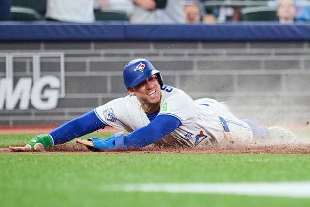 August 10, 2026, Toronto, On, Canada: Toronto Blue Jays George Springer (4) slides in to score on an RBI single by Andres Gimenez (0) during sixth inning MLB, Baseball Herren, USA baseball action against the Boston Red Sox in Toronto, on Monday, Aug. 10, 2026. Canada News - August 10, 2026  - ZUMAc35_ 20260810_zaf_c35_100 Copyright: xSammyxKoganx