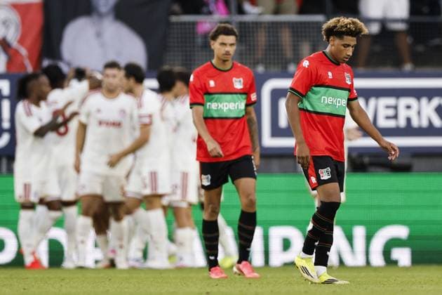 NIJMEGEN - NoÃ Lebreton of NEC Nijmegen, Deveron Fonville of NEC Nijmegen (lr) react after falling 0-1 behind during the 3rd Champions League qualifying round between NEC and Olympiakos Piraeus at De Goffert on August 11, 2026 in Nijmegen, Netherlands. BART STOUTJESDIJK ANP UEFA Champion League Third qualifying round 2nd leg 2026-2027 xVIxANPxSportx xxANPxIVx 565280744 originalFilename: 565280744.jpg