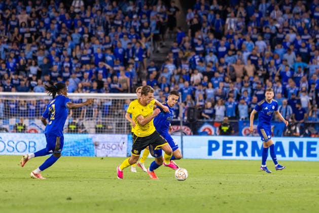 Jeppe Kjaer of Mjallby and Svetozar Markovic of SK Slovan Bratislava seen during UEFA Champions league third qualifying round game between teams of SK Slovan Bratislava and Mjallby (Dominika Kortvelyesiova Ball Raw Images) Bratislava Tehelne Pole stadium Slovakia Copyright: xDominikaxKortvelyesiovax DKR_5742