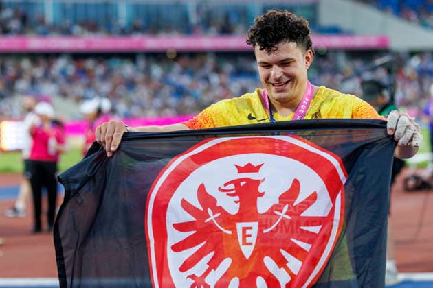 BIRMINGHAM, GREAT BRITAIN - AUGUST 11, 2026: Merlin HUMMEL (GER Germany) wins Silver in the hammer throw and uses the Eintracht Frankfurt flag for celebration during the European Athletics Championships at Alexander Stadium on August 11, 2026 in Birmingham, Great Britain. Great Britain Copyright: xAxelxKohringx