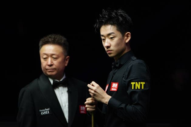 TAIYUAN, CHINA - AUGUST 12: Wu Yize of China chalks the cue in the second round match against David Gilbert of England on day 5 of the 2026 World Snooker Tour China Open at Taiyuan Binhe Sports Center on August 12, 2026 in Taiyuan, Shanxi Province of China.  Copyright: xTaixChengzhex 111659519141
