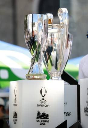 Fans pose for photos in the Super Cup fanzone next to the Super Cup, Champions League and Europa League trophies. Paris St Germain v Aston Villa, UEFA Super Cup Final, Football, Red Bull Arena, Salzburg, Austria - 12 Aug 2026Salzburg Red Bull Arena, Austria  Copyright: xJamesxMarsh Shutterstockx 17064758h