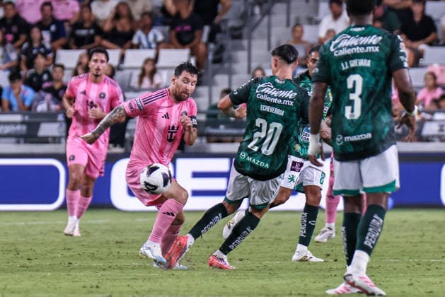 MIAMI, FL - AUGUST 12: Leo Messi 10 of Inter Miami CF and Rodrigo Echeverria 20 of Leon battle for a ball during a Leagues Cup soccer match between Inter Miami CF and Leon at NU Stadium on August 12, 2026 in Miami, Florida.(Photo by Chris Arjoon Icon Sportswire) SOCCER: AUG 12 Leagues Cup Miami vs Monterrey EDITORIAL USE ONLY Icon26081200000042