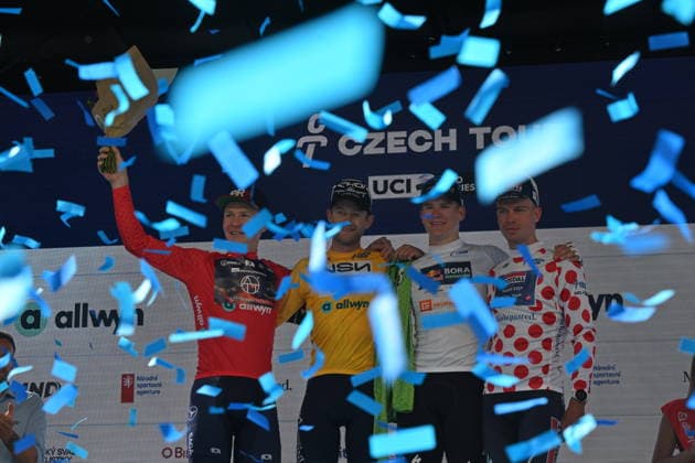 Riley Sheehan of USA won opening stage of the 2026 Czech Tour in Karlovy Vary, Czech Republic, August 13, 2026. From left Neumann Dominik, Riley Sheehan (in yellow jersey), Romet Pajur. (CTKxPhoto SlavomirxKubes) CTKPhotoP2026081305550  CTKPhotoP2026081305550