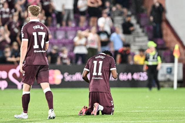 Heart of Midlothian v Benfica UEFA Europa League Stuart Findlay and Pierre Landry Kabore of Heart of Midlothian looks dejected at full time during the UEFA Europa League Third Qualifying Round Second Leg match at Tynecastle Park, Edinburgh 13 08 2026 UK Newspapers OUT Copyright: xJamiexJohnstonx FIL-23768-0210