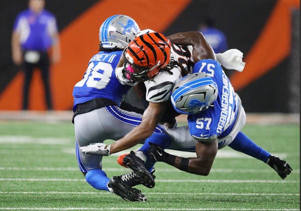CINCINNATI, OH - AUGUST 13: Running back Kendall Milton 36 of the Cincinnati Bengals is tackled by linebacker Amen Ogbongbemiga 57 of the Detroit Lions and cornerback Keith Abney II 28 of the Detroit Lions in a preseason game between the Detroit Lions and the Cincinnati Bengals on August 13, 2026, at Paycor Stadium in Cincinnati, OH. (Photo by Jeff Moreland Icon Sportswire) NFL, American Football Herren, USA AUG 13 Lions at Bengals EDITORIAL USE ONLY Icon168260813026