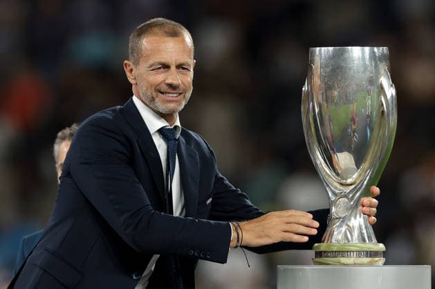 Paris Saint Germain v Aston Villa - UEFA Super Cup - Stadion Salzburg Salzburg, Austria, 12th August 2026. UEFA President Aleksander Ceferin reaches for the UEFA Supercup to present to Marquinhos of PSG following the Paris Saint Germain vs Aston Villa UEFA Super Cup match at Stadion Salzburg, Salzburg. Picture credit should read: Jonathan Moscrop Salzburg Stadion Salzburg Austria