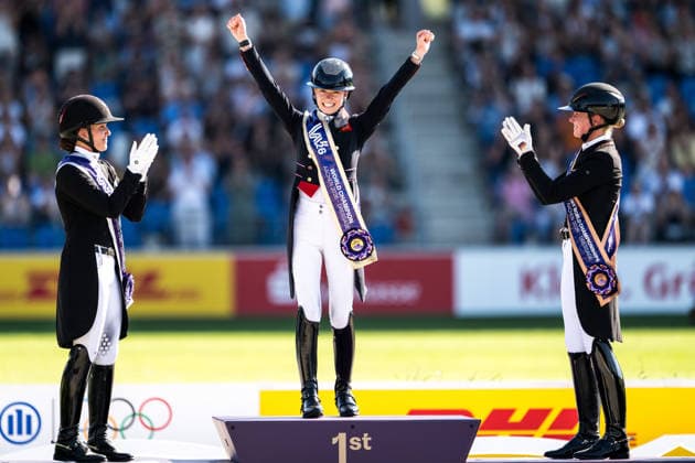 260814 Cathrine Laudrup-Dufour of Denmark celebrates second place, Charlotte Fry of Great Britain first place and Katharina Hemmer of Germany celebrates third place on the podium after competing in the Dressage Grand Prix Special during day 4 of the 2026 FEI World Championships on August 14, 2026 in Aachen. Photo: Emma Wallskog BILDBYRAN kod EW EW0682 ridsport equestrian rid-vm 2026 2026 fei world championships bbeng ridsport-vm dressage dressyr jubel *** August 14, 2026: Cathrine Laudrup Dufour of Denmark celebrates second place, Charlotte Fry of Great Britain celebrates first place, and Katharina Hemmer of Germany celebrates third place on the podium after competing in the Dressage Grand Prix Special on Day 4 of the 2026 FEI World Championships on August 14, 2026 in Aachen. Photo by Emma Wallskog. BILDBYRAN code EW EW0682 equestrian sports 2026 World Championships 2026 FEI World Championships BBENG equestrian sports World Championships dressage celebration  Copyright: EMMAxWALLSKOG BB260814EW100