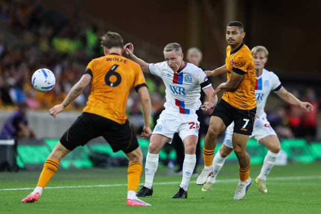 Wolverhampton, England, 14th August 2026. Adam Forshaw of Blackburn Rovers passes the ball during the Wolverhampton Wanderers vs Blackburn Rovers Sky Bet Championship match at Molineux, Wolverhampton. Picture credit should read: Gareth Evans Sportimage EDITORIAL USE ONLY. No use with unauthorised audio, video, data, fixture lists, club league logos or live services. Online in-match use limited to 120 images, no video emulation. No use in betting, games or single club league player publications. SPI_044_GE_WOL_vs_BBR SPI-4907-0043