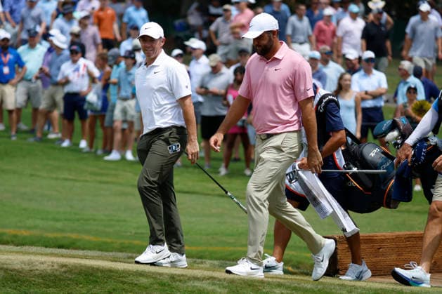 MEMPHIS, TN - AUGUST 14: Rory Mcllroy of Northern Ireland and Scottie Scheffler of the United States walk across a bridge to the No. 11 green during the second round of the FedEx St. Jude Championship, August 14, 2026, at TPC Southwind in Memphis, Tennessee. (Photo by Matthew Maxey Icon Sportswire) GOLF: AUG 14 PGA, Golf Herren FedEx St. Jude Championship EDITORIAL USE ONLY Icon260814073