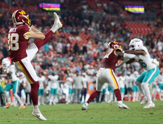August 14, 2026, Landover, Maryland, USA: Washington Commanders punter Matt Haack (38) kicks the ball during the NFL, American Football Herren, USA preseason game between the Washington Commanders and Miami Dolphins at Northwest Stadium on Friday, August 14, 2026; Landover, Maryland, USA. Landover USA - ZUMAs325 20260814_zsp_s325_115 Copyright: xJessxStilesx