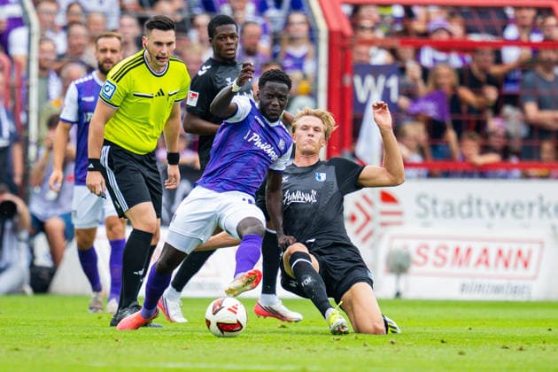 15.08.2026 - Fußball, 2026 2027, 2. Bundesliga, 2. Spieltag, VfL Osnabrück - 1. FC Magdeburg: (L-R) Ismail Badjie (Osnabrück), Luka Hyryläinen (Magdeburg) DFL REGULATIONS PROHIBIT ANY USE OF PHOTOGRAPHS AS IMAGE SEQUENCES AND OR QUASI-VIDEO. *** August 15, 2026 Soccer, 2026–2027, 2. Bundesliga, Matchday 2, VfL Osnabrück 1 FC Magdeburg; Referee: Ismail Badjie (Osnabrück), Assistant Referee: Luka Hyryläinen (Magdeburg); DFL regulations prohibit any use of photographs as image sequences and or quasi-video