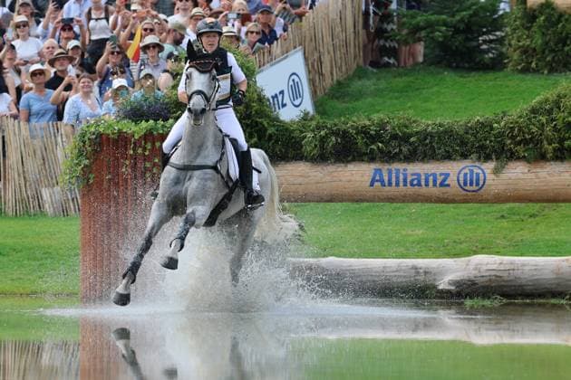 Malin Hansen-Hotopp (GER, Deutschland, Germany) mit Pferd Carlitos Quidditch K, Allianz Versicherung, Wasserhindernis , Vielseitigkeit Dressur, FEI Eventing World Championship, WM, Weltmeisterschaft , DHL-Preis, Einzel Mannschaft, Geländeprüfung, Teilprüfung Gelände, Cross Country , AACHEN - FEI World Championships 2026, Weltfest des Pferdesports, Reitsport Weltmeisterschaft 2026, Aachen 2026, Welcome Home 2026, Aachener Soers, 11. bis 23. August 2026, Reitsport, 15.08.2026, Aachen Aachener Soers Deutschland *** Malin Hansen Hotopp GER, Germany, with her horse Carlitos Quidditch K, Allianz Insurance, Water Jumping, Eventing Dressage, FEI Eventing World Championship, DHL Prize, Individual and Team, Cross-Country, Cross-Country Stage, AACHEN FEI World Championships 2026, World Festival of Equestrian Sports, 2026 Equestrian World Championships, Aachen 2026, Welcome Home 2026, Aachen Soers, August 11–23, 2026, Equestrian Sports, August 15, 2026, Aachen Soers, Germany