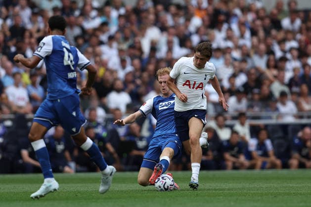 RECORD DATE NOT STATED 15th August 2026; Tottenham Hotspur Stadium, London, England; Friendly Football, Tottenham Hotspur versus TSG Hoffenheim; Mikey Moore of Tottenham Hotspur is tackled by Mats Rots of TSG Hoffenheim KatiexChan