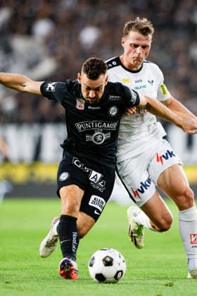 SOCCER - BL, Sturm vs Altach GRAZ,AUSTRIA,15.AUG.26 - SOCCER - ADMIRAL Bundesliga, SK Sturm Graz vs SCR Altach. Image shows Juergen Heil (Sturm) and Benjamin Bockle (Altach).  GEPAxpictures xJamesxDoak