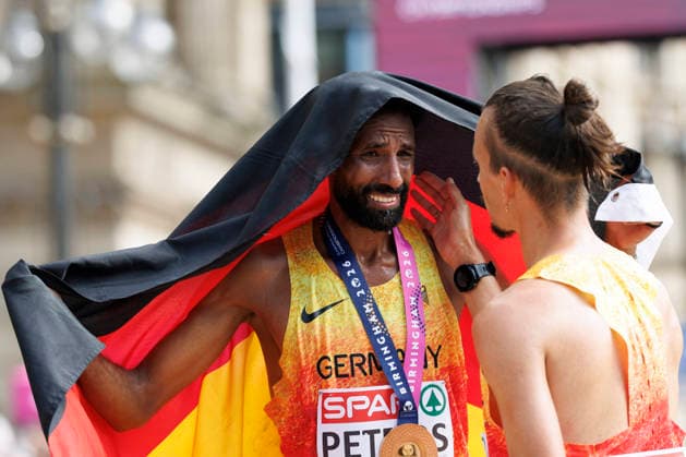 BIRMINGHAM, GREAT BRITAIN - AUGUST 16, 2026: Amanal PETROS (GER Germany) wins in the marathon during the European Athletics Championships on August 16, 2026 in Birmingham, Great Britain. Simon BOCH (GER Germany) congrats. Great Britain Copyright: xAxelxKohringx