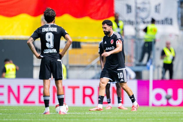 16.08.2026 - Fußball, 2026 2027, 2. Bundesliga, 2. Spieltag, DSC Arminia Bielefeld - FC Energie Cottbus: (L-R) Lucas Copado (Cottbus), Tolcay Cigerci (Cottbus) nach dem Tor zum 1:0 von Joel Grodowski (Bielefeld) DFL REGULATIONS PROHIBIT ANY USE OF PHOTOGRAPHS AS IMAGE SEQUENCES AND OR QUASI-VIDEO. *** August 16, 2026 Soccer, 2026–2027, 2. Bundesliga, Matchday 2, DSC Arminia Bielefeld vs. FC Energie Cottbus, Referee: Lucas Copado (Cottbus), Tolcay Cigerci (Cottbus) after Joel Grodowski (Bielefeld) scored the 1–0 goal. DFL regulations prohibit any use of photographs as image sequences and or quasi-video.