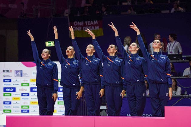 August 16, 2026, Frankfurt, Hesse, Germany: The Spanish team, comprised of INES BERGUA NAVALES, ANDREA CORRAL, MARINA CORTELLES, ANDREA FERNANDEZ, LUCIA MUNOZ, and SALMA SOLAUN, point upwards after finishing second in the 42nd Rhythmic gymnastics, Rhythmische Sportgymnastik, RSG World Championships group three hoops and two pairs clubs finals in the Festhalle in Frankfurt, Hesse, Germany on Sunday, August 16, 2026. 2026 Rhythmic Gymnastics World Championships Group Finals  - ZUMAd168 20260816_zsp_d168_055 Copyright: xKaixDambachx