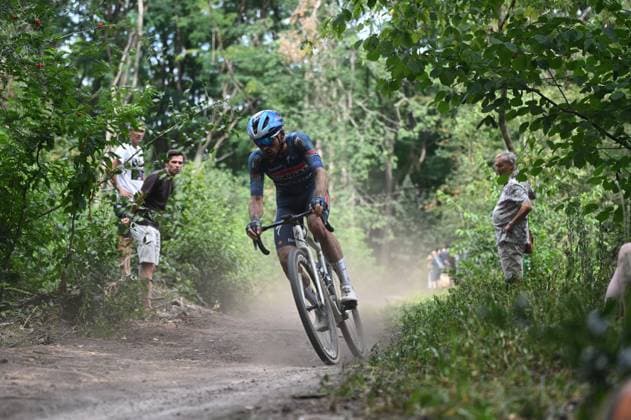 Belgian Stan Van Tricht of Soudal Quick-Step Devo Team pictured in action at the elite race at the Belgian Gravel Championships, Sunday 16 August 2026 in Grobbendonk. ELIASxROM  x0864196552stx