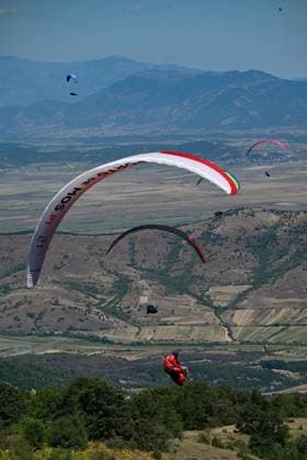 (260816) -- KRUSHEVO, Aug. 16, 2026 -- Participants compete during the 18th World Air Sports Federation (FAI) European Paragliding Championships in Krushevo, North Macedonia, Aug.16, 2026. The event is taking place from Aug. 8 to 19, bringing together 130 of Europe s top pilots. (Photo by Tomislav Georgiev Xinhua) (SP)NORTH MACEDONIA-KRUSHEVO-EUROPEAN PARAGLIDING CHAMPIONSHIPS LinxHao 