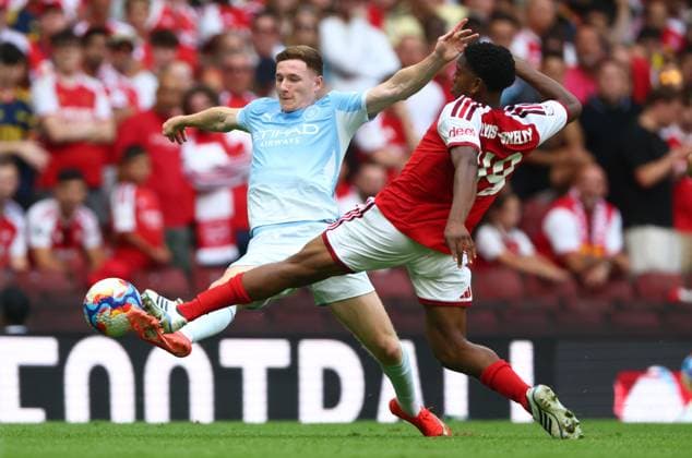 Elliott Anderson of Manchester City is caught late by Myles Lewis-Skelly of Arsenal Arsenal v Manchester City, FA Community Shield, Football, Principality Stadium, Cardiff, Wales, UK - 16 Aug 2026Cardiff Principality Stadium Wales United Kingdom EDITORIAL USE ONLY No use with unauthorised audio, video, data, fixture lists, club league logos or live services. Online in-match use limited to 120 images, no video emulation. No use in betting, games or single club league player publications.  Copyright: xKieranxMcManus Shutterstockx 17070166bh
