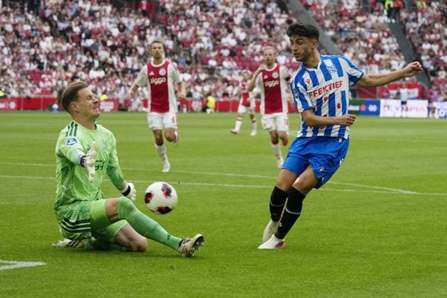 AMSTERDAM ,16-08-2026, JohanCruijff ArenA , season 2026 2027 , Dutch Eredivisie Football Match between Ajax and SC Heerenveen. Picture shows Ajax goalkeeper Marc ter Stegen , SC Heerenveen player Luca Oyen Ajax - Heerenveen  x205780241x Copyright: