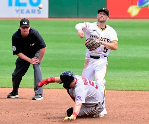 Pittsburgh Pirates second baseman Brandon Lowe (5) makes the force out on Boston Red Sox third baseman Caleb Durbin (5) and throws to first base to complete the double play in the second inning at PNC Park on Sunday, Aug. 16, 2026 in Pittsburgh.  PIT2026081613 ArchiexCarpenter
