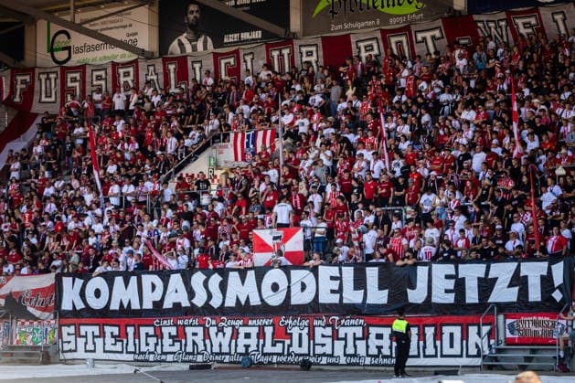 Erfurt, 150826, Northeast Regional Soccer League: FC Rot Weiss Erfurt vs. 1 FC Magdeburg U23. Pictured: Erfurt fans holding a banner calling for promotion reform, the Kompass model. Now