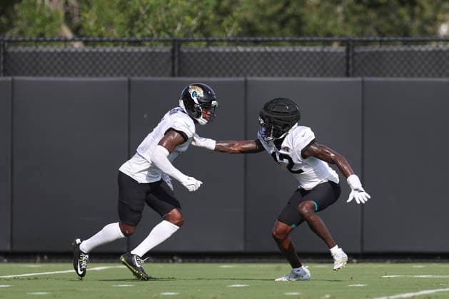 JACKSONVILLE, FL - AUGUST 17: Jacksonville Jaguars cornerback Montaric Brown (1) and Jacksonville Jaguars wide receiver Travis Hunter (12) work on a drill during training camp on August 17, 2026 at the Miller Electric Center in Jacksonville, Fl. (Photo by David Rosenblum Icon Sportswire) NFL, American Football Herren, USA AUG 17 Jaguars Training Camp EDITORIAL USE ONLY Icon260817238625