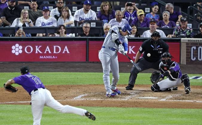 Baseball: Dodgers vs. Rockies Los Angeles Dodgers designated hitter Shohei Ohtani hits a solo home run off Colorado Rockies pitcher Tomoyuki Sugano in the fifth inning of a baseball game at Coors Field in Denver, Colorado, on Aug. 17, 2026.  A14AA0005626111P