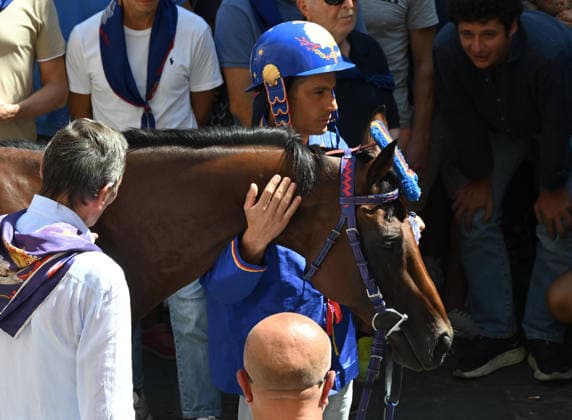 August 18, 2026, Siena, Italy: Jockey Giovanni Atzeni, nicknamed Tittia and his horse Anda e Bola of Contrade Nicchio during the blessing of the historical Italian horse race Palio di Siena, in Siena, Italy, 18 August 2026. ANSA CLAUDIO GIOVANNINI Traditional Palio Di Siena Horses Race In Siena  - ZUMAa110 20260818_zaf_a110_003 Copyright: xClaudioxGiovanninix