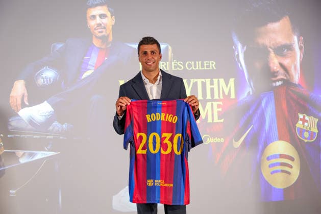 Rodri officially presented as Barcelona player BARCELONA, SPAIN - AUGUST 18: Rodrigo Hernandez Rodri of FC Barcelona, Barca poses with an FC Barcelona shirt bearing his name and the year 2030 during his official presentation as an FC Barcelona player at Spotify Camp Nou on August 18, 2026, in Barcelona, Spain. Adria Puig Anadolu Barcelona Spain. Editorial use only. Please get in touch for any other usage.  Copyright: x2026xAnadoluxAdriaxPuigx