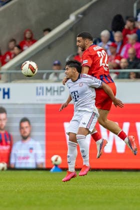 Kopfballduell Oualid Mhamdi (1.FC Heidenheim, 22) Maycon Cardozo (FC Bayern Muenchen, 49) Mimik, GER, 1. FC Heidenheim vs. FC Bayern Muenchen, Fußball, Testspiel, 2026 2027, 18.08.2026, DFL DFB REGULATIONS PROHIBIT ANY USE OF PHOTOGRAPHS AS IMAGE SEQUENCES AND OR QUASI-VIDEO, GER, 1. FC Heidenheim vs. FC Bayern Muenchen, Fußball, Testspiel, 2026 2027, 18.08.2026 Heidenheim *** Heading duel: Oualid Mhamdi (1. FC Heidenheim) vs. Maycon Cardozo (FC Bayern Munich), 49 facial expressions, GER, 1. FC Heidenheim vs. FC Bayern Munich, soccer, friendly match, 2026–2027, August 18, 2026, DFL and DFB regulations prohibit any use of photographs as image sequences and or quasi-video, GER, 1 FC Heidenheim vs. FC Bayern Munich, soccer, friendly match, 2026–2027, August 18, 2026, Heidenheim Copyright: xEibner-Pressefoto JanixPlessx EP_JPL