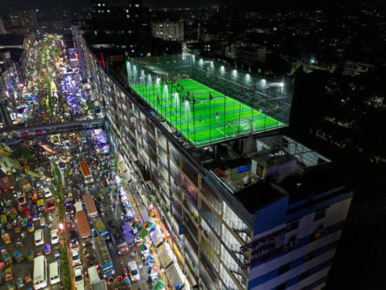 Rooftop Football In A Crowded Megacity People play football on an artificial rooftop field atop an 11-story building, surrounded by dense buildings, busy streets and heavy traffic in Dhaka, Bangladesh, on August 18, 2026. Dhaka Bangladesh  Copyright: xBipulxAhmedx originalFilename:mondol-notitle260818_npY39.jpg