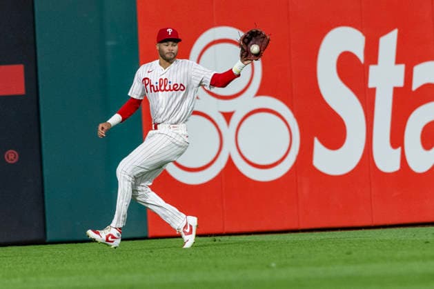 Philadelphia Phillies center fielder Justin Crawford fields an RBI single from Miami Marlins Xavier Edwards during the fifth inning of a baseball game, Tuesday, Aug. 18, 2026, in Philadelphia, Pennsylvania.  PHI20260818010 LaurencexKesterson