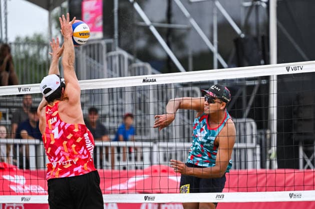 MONTREAL, QC - AUGUST 19: Louis Charbonneau (CAN) blocks Renato Andrew Lima de Carvalho (BRA) smash during a qualification match at Beach Pro Tour Montreal Elite 16 on August 19, 2026 at Parc Jean-Drapeau in Montreal, QC (Photo by David Kirouac Icon Sportswire) VOLLEYBALL: AUG 19 Beach Pro Tour Montreal Elite 16 EDITORIAL USE ONLY Icon26081901326